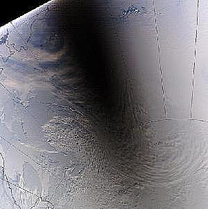 Real time image (from Aqua) of the moving shadow against the ice-covered Antarctic surface caused when the Moon eclipsed the Sun on November 23, 2003.
