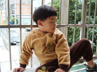 Photo of boy in western-style outfit