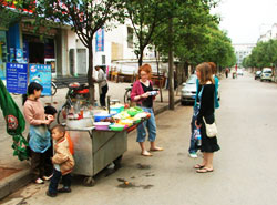 Roadside stalls offered numerous delicacies including stuffed pancakes, steaming bowls of noodles and Chinese-style burgers