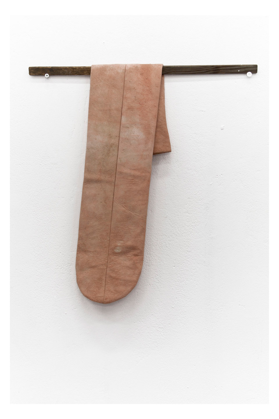 <p>Hung Out, 2013, wood, leather, screws, wall paint, 42 x 35 x 2 cm</p>