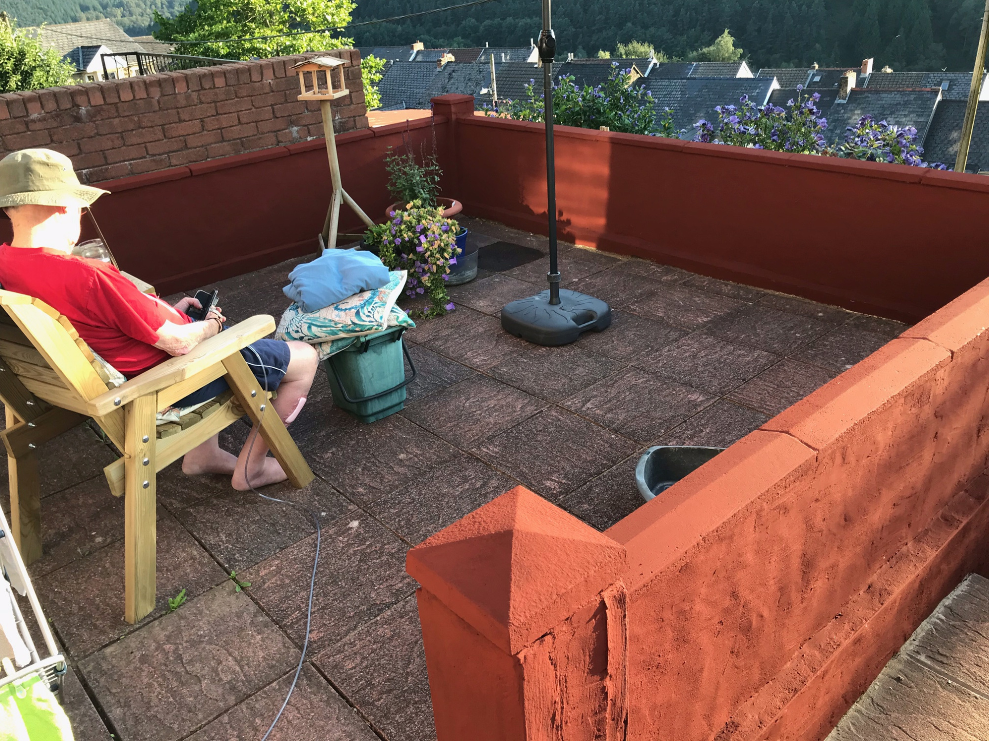 Painted patio with Six Bells red, Abertillery, Blaenau Gwent, South Wales
