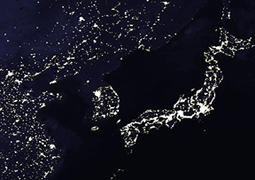 DMSP nighttime image that shows a darkened North Korea that stands in sharp contrast to the many lit towns and cities in a properous South Korea.