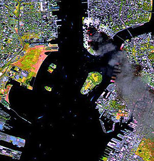 SPOT-3 20 m image of the fires and smoke from the destroyed World Trade Center in New York City; an infrared band allows better rendition of the actual flames.