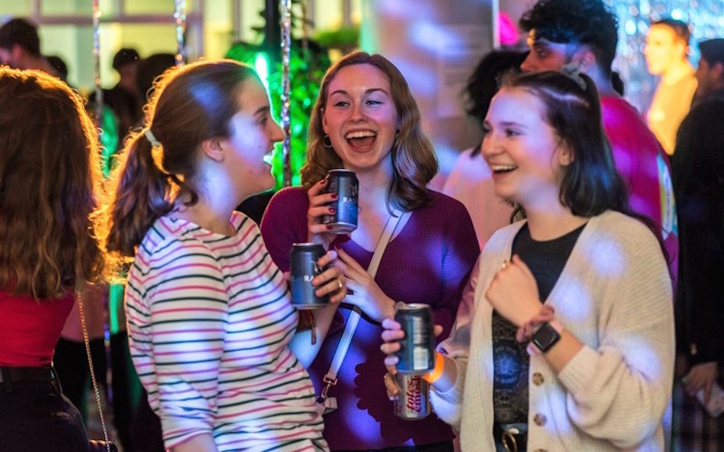 Students socialising in a bar - Staying safe in London
