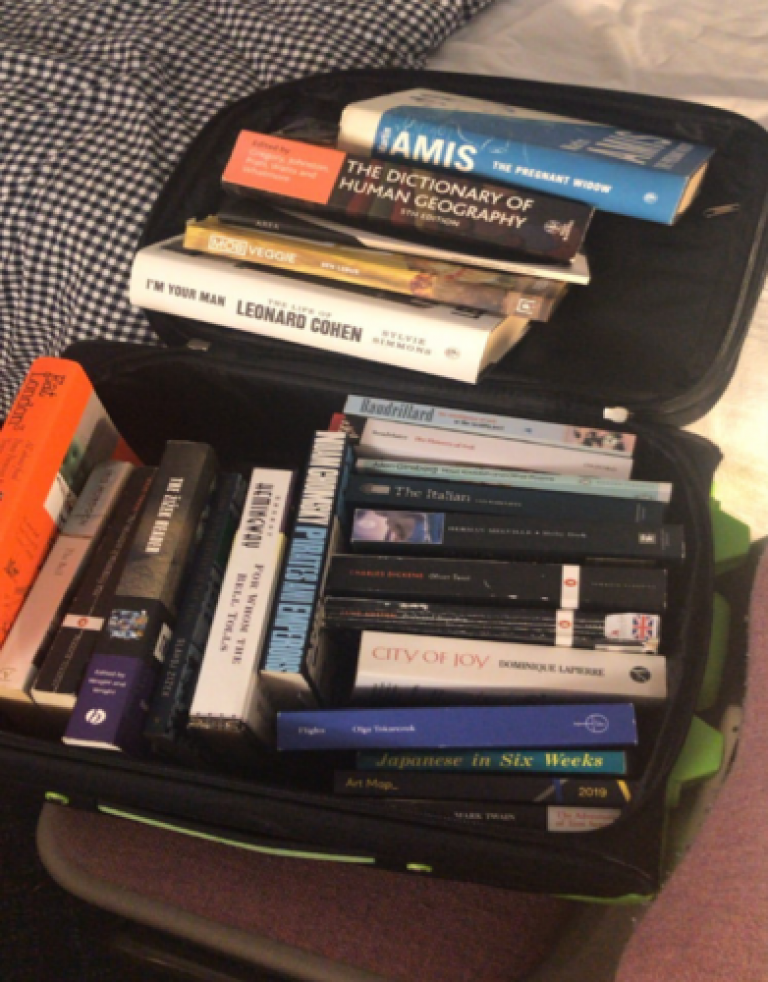 Suitcase full of books - things to bring to university