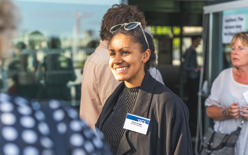A smiling woman at a UCL alumni event