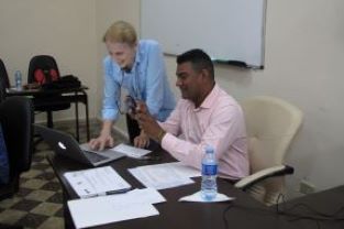 Photograph of Dr Emily Morris and Dr Jose Pena preparing for a presentation as part of a joint research project