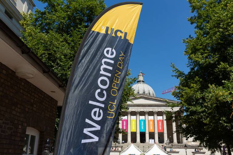 Image of a welcome banner in front of the UCL Portico on a sunny open day