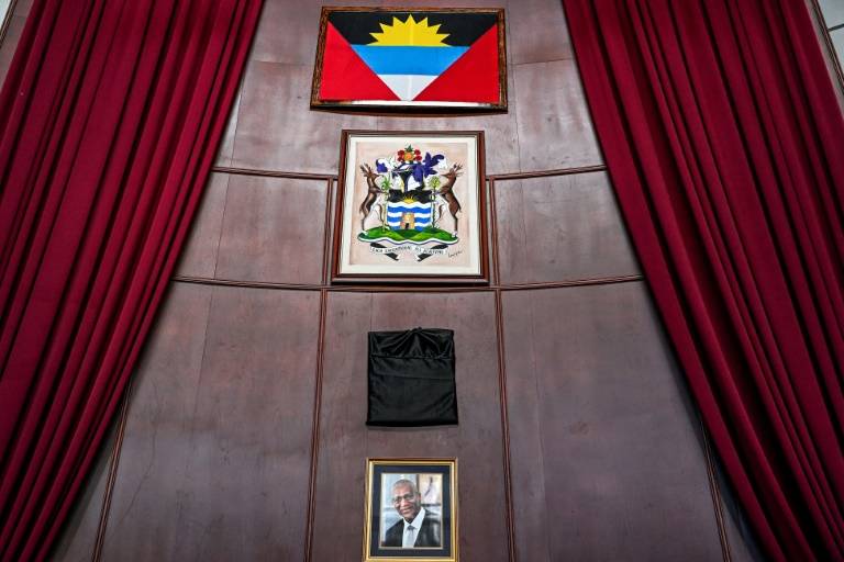 Photo showing black cloth covering the portrait of Queen Elizabeth II hanging in Antigua's parliament