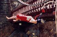 Man bungee jumping from bridge