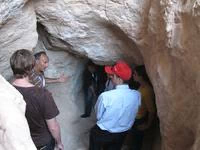 Uzi Avner discussing a mine shaft in Nahal Amram