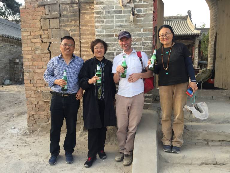 Dom stands with colleagues after a day surveying on the Shanxi project