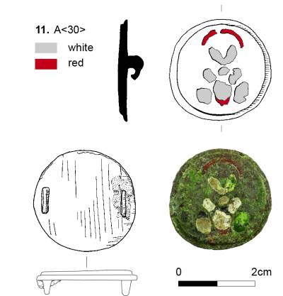 A composite image showing photographs and illustrations of a round brooch. The brooch is around 2cm in diameter and features red and white enamel decoration on the front. The back of the brooch features two raised pieces for the fastening.