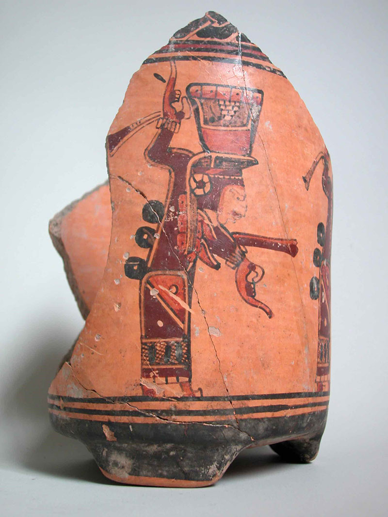 Terracotta-coloured ancient pottery vessel with painted figure in red/brown/orange colours