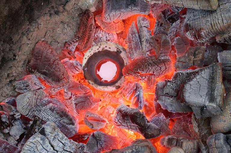 Furnace image with grey charcoal at edge and hot orange/red colours in centre