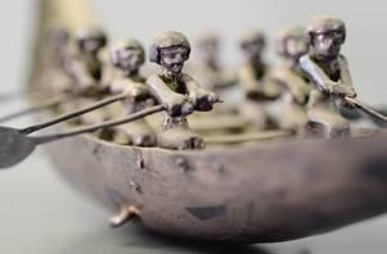 Ancient Egyptian (metal) artefact of figures in a boat