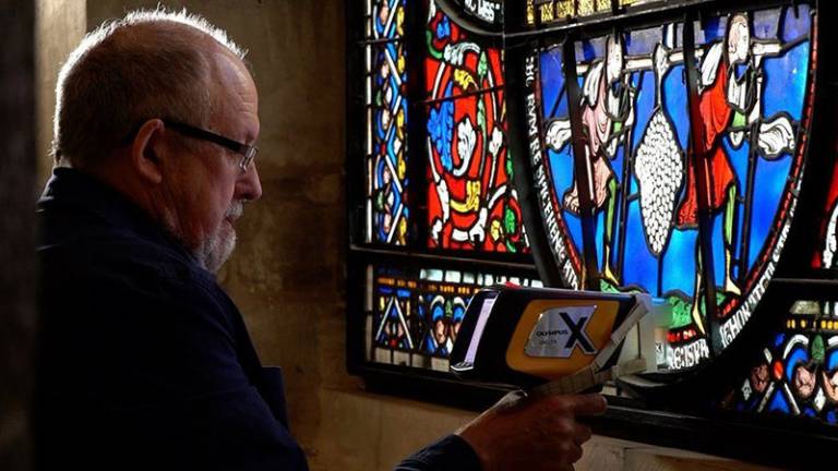 Ian Freestone analysing stained glass at Canterbury Cathedral (Image courtesy The Chapter, Canterbury Cathedral/BBC)