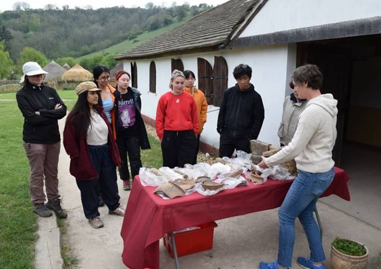 Institute students with Louise Rayner (Archaeology South-East) studying the pottery assemblage and kiln furniture from the original excavation 