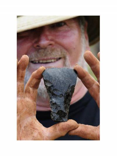 Robert Nunn with obsidian adze from the Puna Pau statue quarry excavations