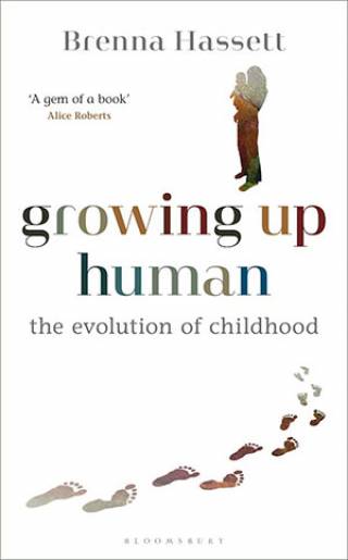 Bookcover with white background and colourful title text and line of footprints leading to an adult holding a baby figure