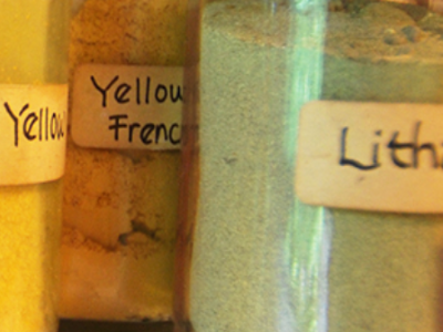 Yellow and green powders used for making different colour paints.