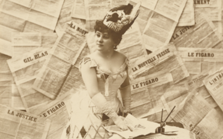 a woman with newspapers in the background
