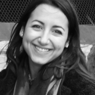 Black and white image of Smiling academic Dr Moran Sheleg