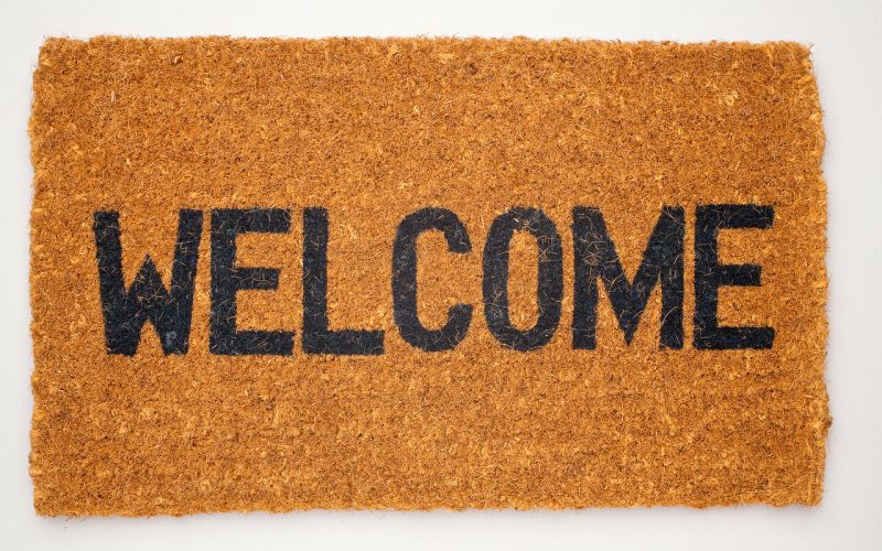 Brown doormat saying 'Welcome' 