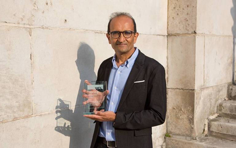 Prof Raman Prinja with award