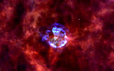 Herschel image of the Galactic Supernova Remnant Cassiopeia A. Blue is supernova dust emission at a wavelength of 70 microns and red is interstellar dust emission at a wavelength of 160 microns