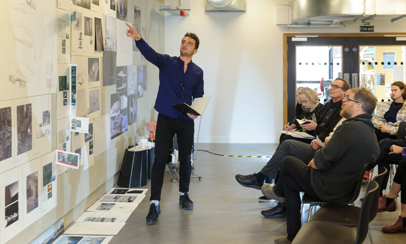 A student presenting his work during the Open Crits 2017