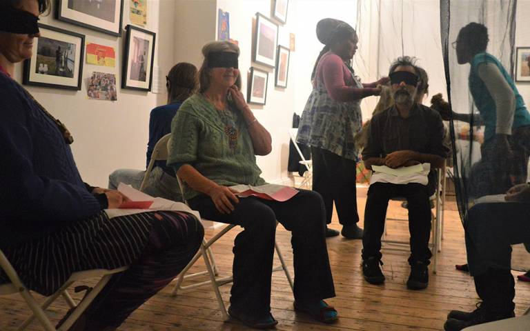 blindfolded participants sat on chairs smelling foods
