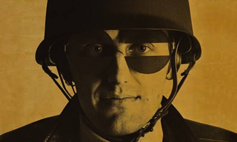 vintage photograph of a man wearing a helmet and glasses with the centre removed