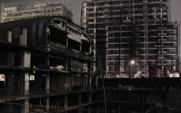 Black and white photo of demolished flats