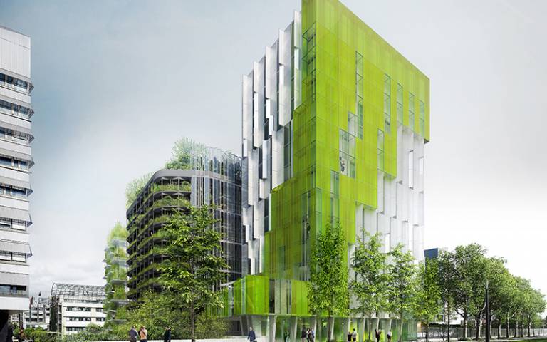 Tall blocks of flats and office with green colouring and lots of plants