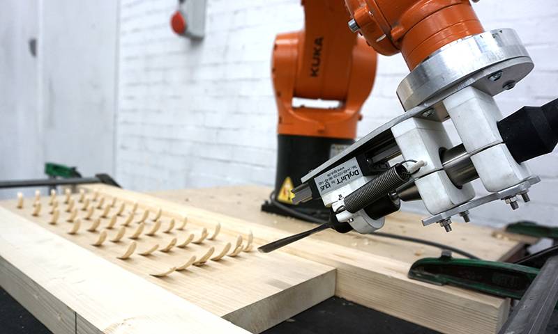 Robotic arm used to chisel wood