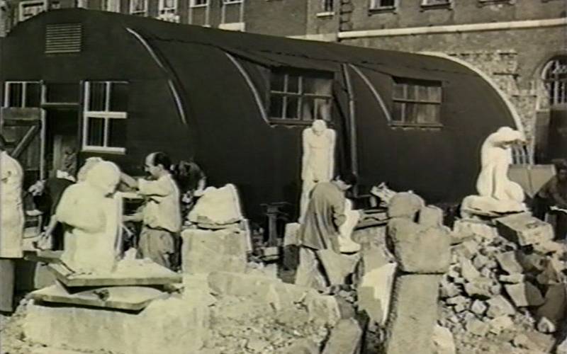 “Sculpture students carving bomb debris in East London”. Still from an unidentified film. London Metropolitan University Archives.