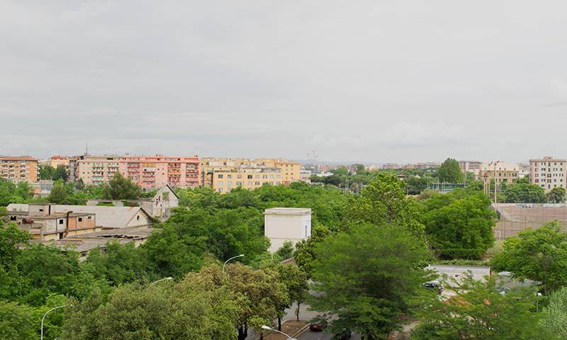 A view of apartments surrounded by trees