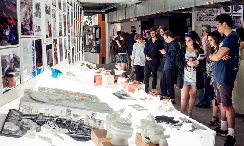 Students and visitors looking at work during the Summer Show 2015 opening