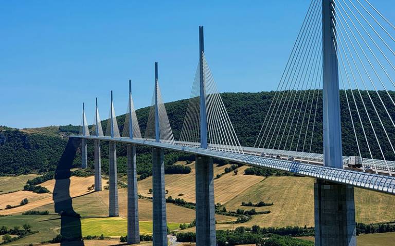 The Millau Bridge, in Southern France, crosses the Tarn River in the Massif Central Mountains as part of the A75 Motorway. 