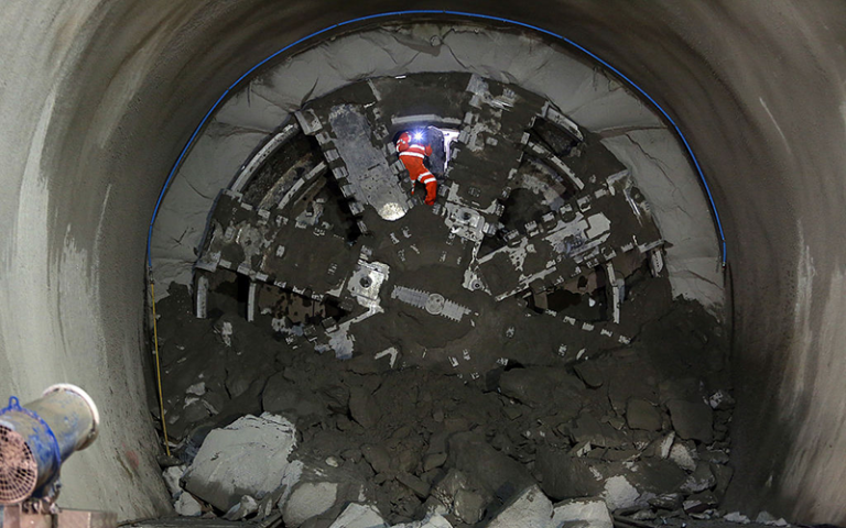 Construction worker takes a photo during the Crossrail project