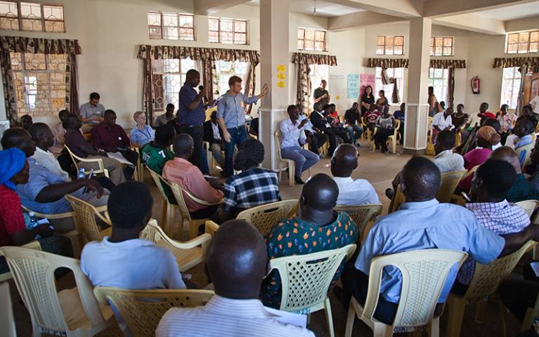 Students and project partners gather in a hall in Kisumu, Kenya