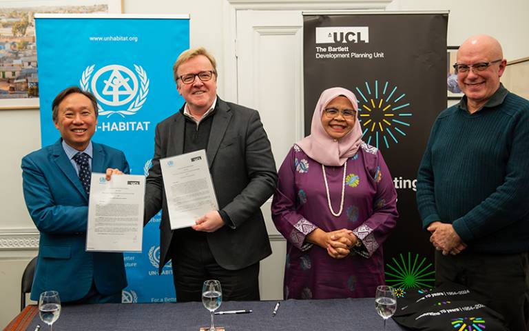 Image of Mr. Neil Khor, Professor Geraint Rees, Maimunah Mohd Sharif and Professor Michael Walls signing a Memorandum of Understanding (MoU) between UN-Habitat and UCL 