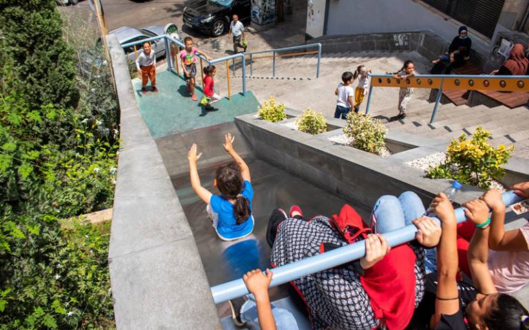 Children playing on steps playground in Lebanon