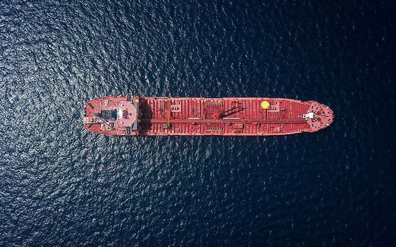 Aerial photograph of red tanker ship in the sea