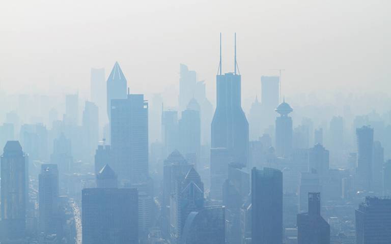 Photo of buildings surrounded by air pollution