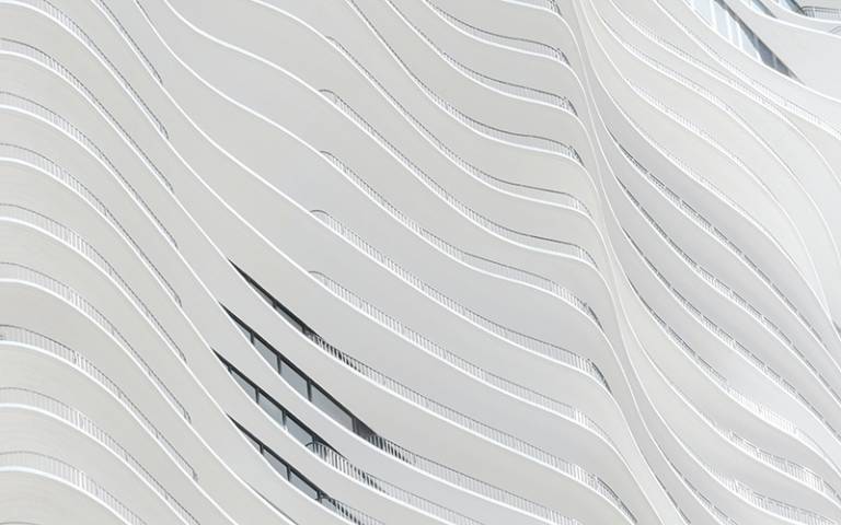 Close up photo of the white concrete curved panels of the Aqua skyscraper, Chicago, USA.