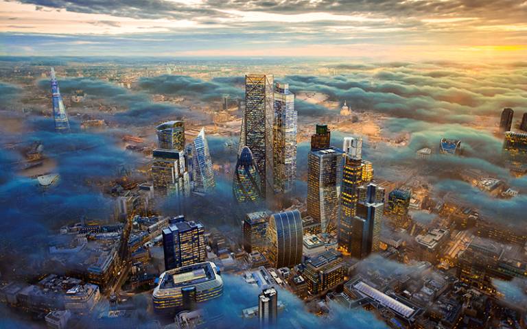 Aerial view of London cityscape through the clouds