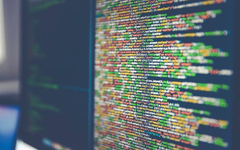 Photo of a screen with HTML source code for webdesign