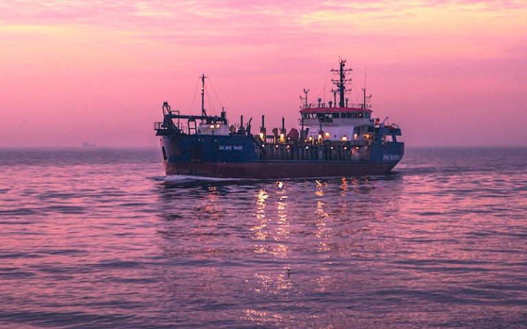 Tanker on a sea at sunset